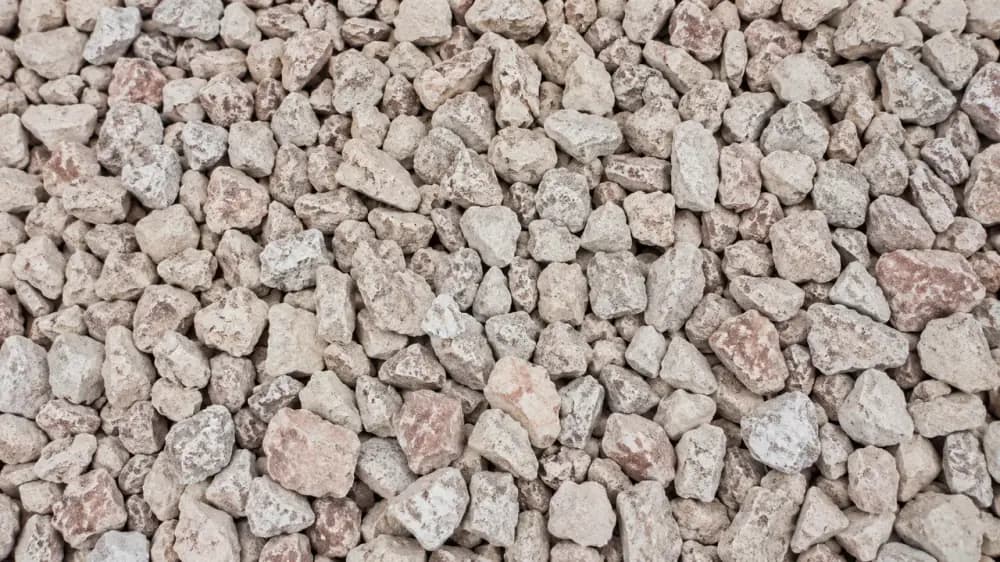 Coarse hardcore and kokoto stone pile ready for bulk construction delivery