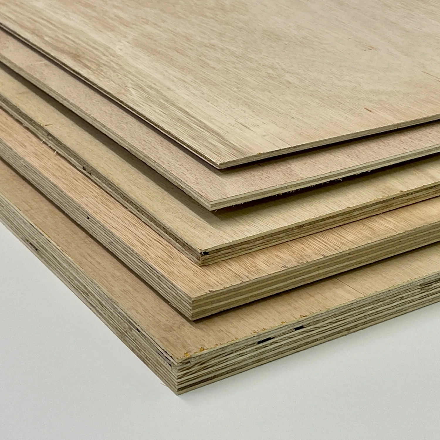 Stacked plywood sheets showing multiple thicknesses and cross-laminated veneer edges