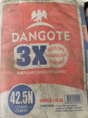 Stacked bags of premium Portland cement in warehouse